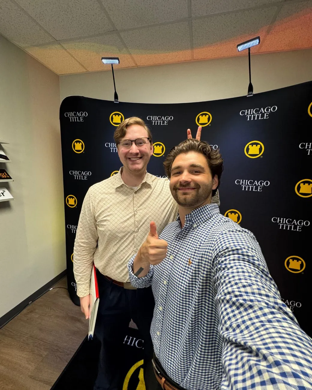 Dillon Baker with a client after closing