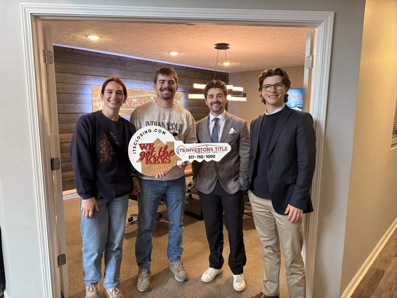 Dillon Baker with clients at closing